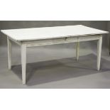 A late 20th century white painted pine kitchen table fitted with a frieze drawer, height 76cm,