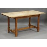 A late 19th century pine kitchen table, raised on ring turned legs, height 73cm, length 152cm, depth