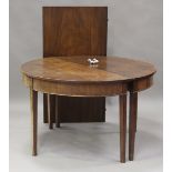 A George III mahogany 'D' end dining table with a single extra leaf, on square tapering legs, height