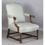 A George III mahogany framed Gainsborough style library armchair, upholstered in pale green