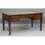 An early/mid-20th century mahogany writing desk, the top inset with tooled green leather above