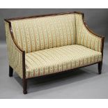 An Edwardian mahogany and boxwood inlaid salon settee, upholstered in a striped damask, height 83cm,