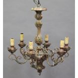 A pair of early 20th century gilded composition and wrought metal mounted six-branch ceiling lights,