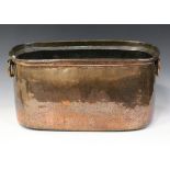 A late 19th century hammered copper log bin of curved rectangular form, each side fitted with a