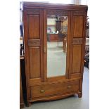 An Edwardian walnut wardrobe with carved foliate and strapwork bands, height 197cm, width 120cm,
