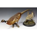A late Victorian taxidermy specimen of a partridge, the stuffed bird mounted within a glass dome,