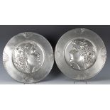 A pair of Art Nouveau WMF plated pewter chargers, model numbers '294' and '294A', cast with opposing