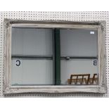 A modern Victorian style grey painted wall mirror with foliate moulded crestings, 76cm x 106cm.