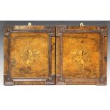 A pair of late Victorian burr walnut inlaid rectangular panels, each decorated with a musical