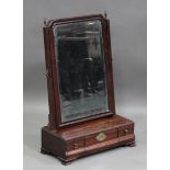 A George II mahogany dressing table mirror, the bevelled plate and cushion moulded frame above three