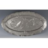 An Art Nouveau pewter oval serving platter, probably WMF, cast with two fish amongst bubbles and