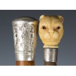 A late 19th century bamboo and ivory handled walking cane, the handle modelled as the head of a wild