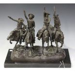 After Frederick Remington - Four Cowboys on Horseback, a modern brown patinated cast bronze