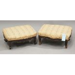 A pair of late 19th century carved walnut footstools, height 15cm, width 33cm, depth 27cm.