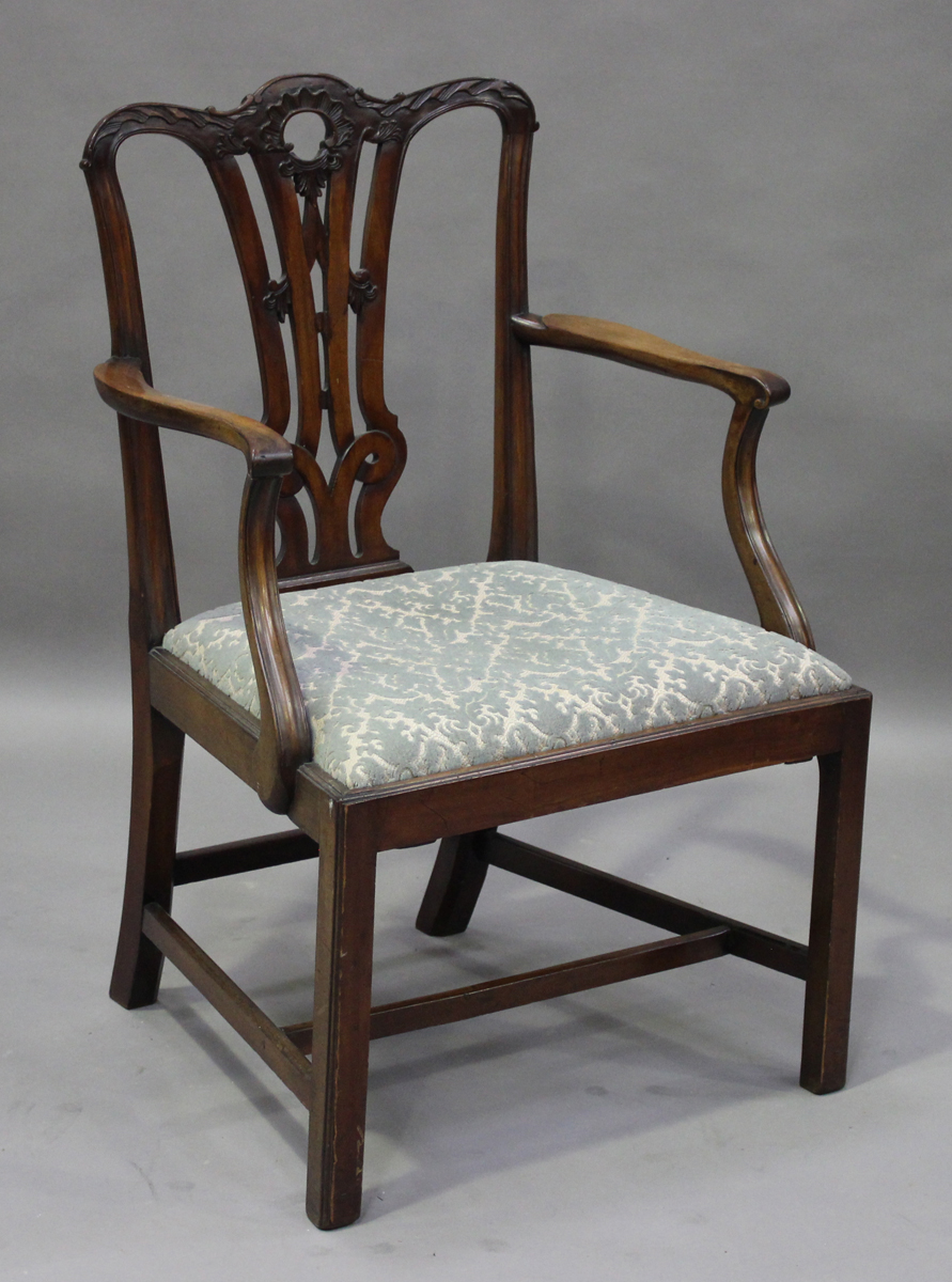 A George III Chippendale period mahogany elbow chair, the pierced splat back finely carved with