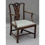 A George III Chippendale period mahogany elbow chair, the pierced splat back finely carved with