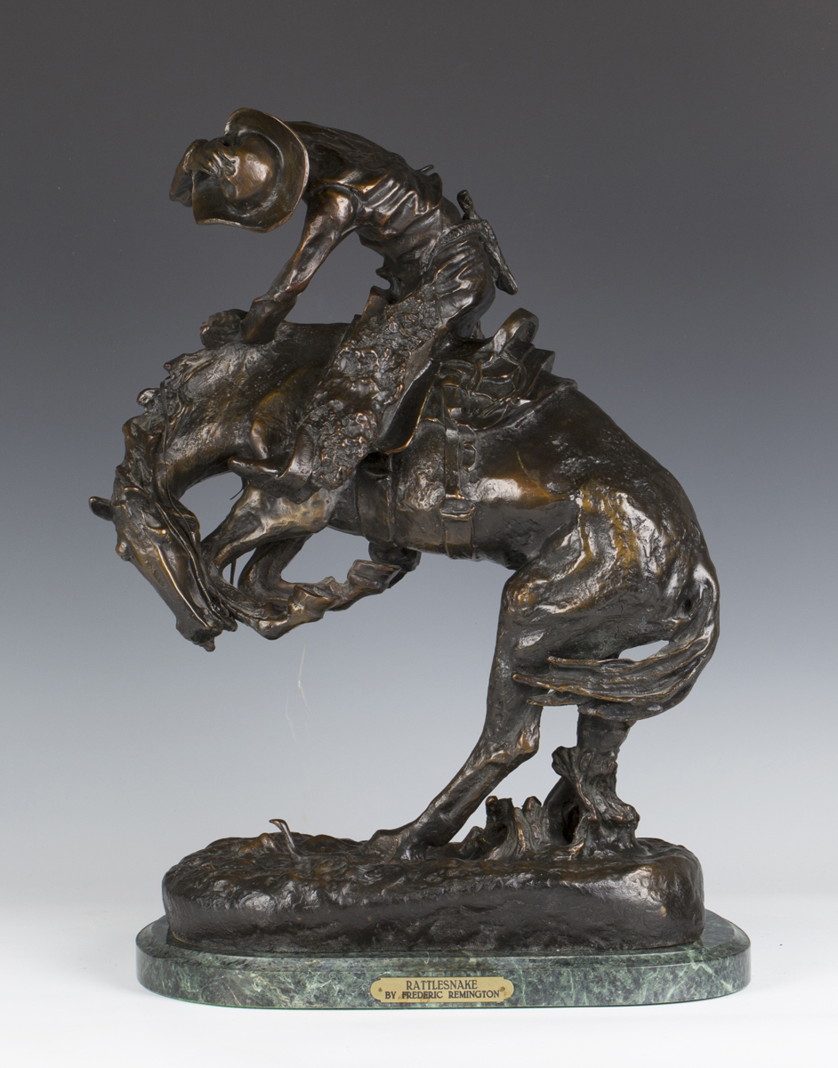 After Frederic Remington - The Rattlesnake, a mid/late 20th century brown patinated cast bronze
