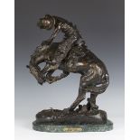 After Frederic Remington - The Rattlesnake, a mid/late 20th century brown patinated cast bronze