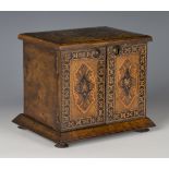 A mid-Victorian Tunbridge ware walnut table-top needlework cabinet, the top with a floral spray