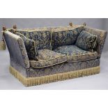 A modern Knole settee by Ashley Lawrence, upholstered in a gold and blue velour, fitted with beech