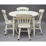 A 20th century white painted extending kitchen table, closed diameter 106cm, together with a set
