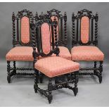 A set of four late Victorian Carolean Revival carved oak dining chairs, upholstered in patterned