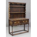 An early 20th century oak dresser, the shelf back above two drawers, height 192cm, width 125cm,