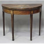 A George III mahogany fold-over demi-lune tea table with tulipwood crossbanding and inlaid fan