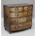 A Regency mahogany bowfront chest, raised on turned legs, height 101cm, width 104cm, depth 50cm (