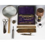 A group of collectors' items, including a wooden cased set of draftsman's instruments, two rulers, a