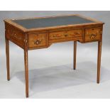 An Edwardian satinwood writing desk with overall painted floral decoration, the top inset with