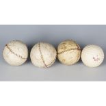 A group of three feather-filled, white leather golf balls, diameter 4.3cm, together with a Dunlop 65