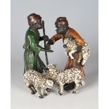 A 20th century cold painted cast bronze figure group of two shepherd boys and three sheep, height