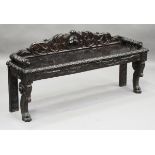 A late Victorian Carolean Revival carved oak window seat, raised on scroll and claw supports, height