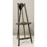 A late Victorian oak framed artist's easel with carved foliate decoration, height 203cm, width