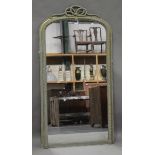 A late Victorian gilt gesso overmantel mirror, the arched frame with a ropetwist surmount and banded