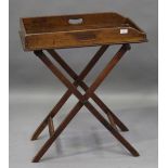 A Victorian mahogany butler's tray, the gallery with pierced handles, raised on an 'X' framed