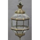 A 20th century Moroccan gilt metal hanging ceiling lantern of pierced octagonal form, height 60cm.