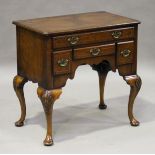 A 20th century Queen Anne style walnut lowboy with kingwood feather banding and oak drawer-