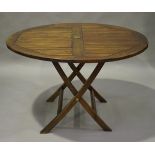 A modern teak folding garden table, height 78cm, diameter 122cm.Buyer’s Premium 29.4% (including VAT