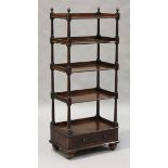 An early Victorian mahogany five-tier galleried whatnot with turned acorn finials, the base fitted