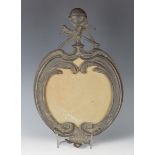 A 19th century brown patinated cast bronze mirror frame, the foliate scrolling surround with Masonic