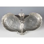 An Art Nouveau WMF style pewter lobed serving dish, the handle cast with a nymph, width 30cm.Buyer’s