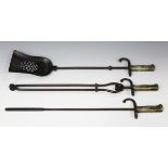 A steel and brass three-piece fire tool set, fitted with French 1874 model Gras bayonet handles,
