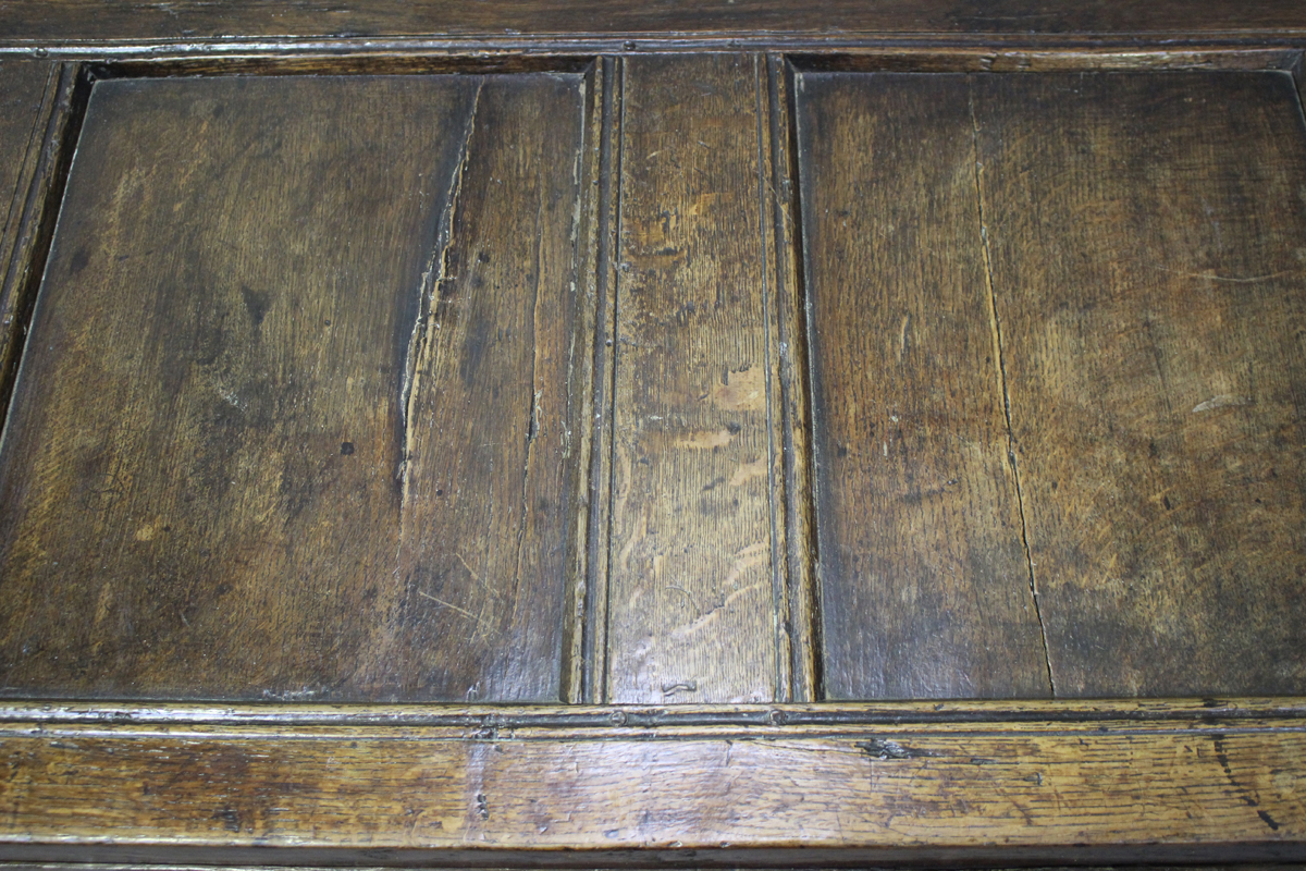 An early 18th century panelled oak coffer with channel moulded decoration, height 68cm, width 141cm, - Image 3 of 4