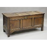An early 18th century panelled oak coffer with channel moulded decoration, height 68cm, width 141cm,