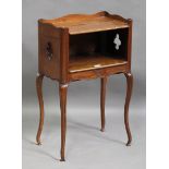 A 20th century French fruitwood bedside table, the galleried top above pierced quatrelobe sides, the