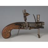 A late 18th century steel flintlock pistol tinder lighter, the hinged box compartment detailed '