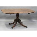 A late George III 'plum pudding' mahogany rectangular tip-top breakfast table, raised on four reeded