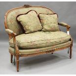 A late 20th century Louis XVI style stained beech showframe two-seat settee, upholstered in a